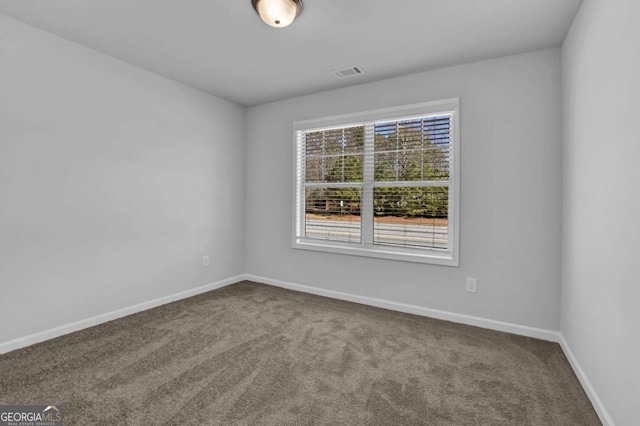 unfurnished room featuring carpet flooring