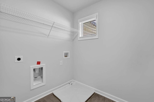 clothes washing area featuring hookup for a washing machine, gas dryer hookup, and electric dryer hookup