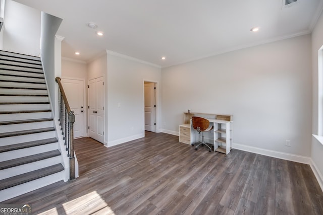 unfurnished office with dark hardwood / wood-style flooring and crown molding