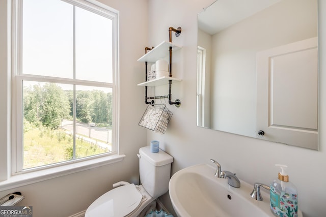 bathroom featuring toilet and sink