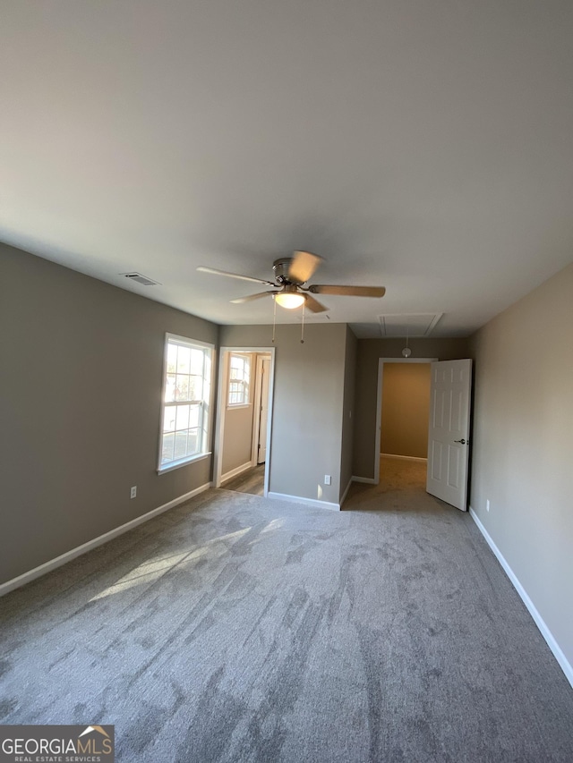 unfurnished bedroom with carpet floors and ceiling fan