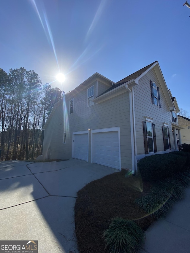 view of property exterior featuring a garage