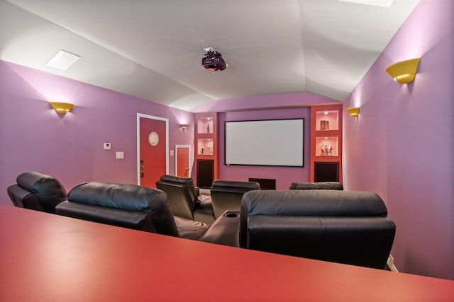 cinema room featuring lofted ceiling