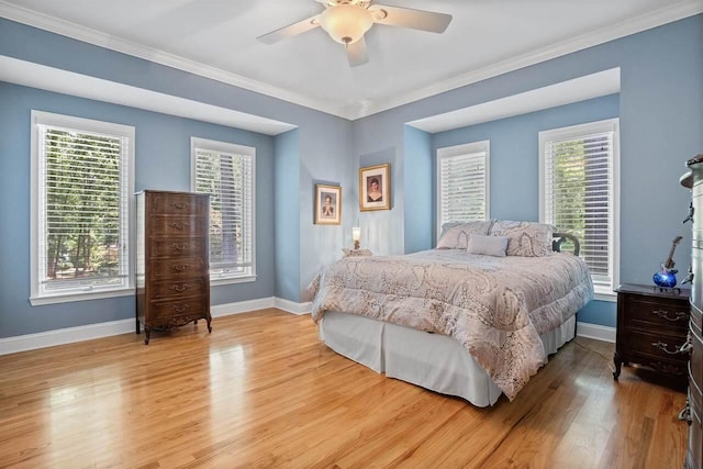 bedroom with crown molding, ceiling fan, and light wood-type flooring