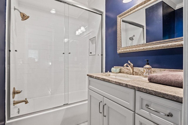 bathroom with vanity and bath / shower combo with glass door