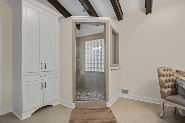 bathroom with tile patterned floors, a shower with door, and vaulted ceiling with beams