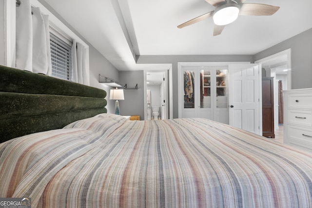 bedroom with ceiling fan and ensuite bathroom