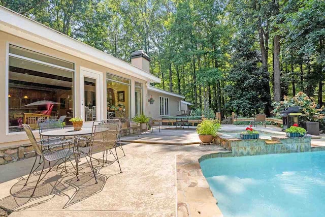 view of pool featuring a patio area