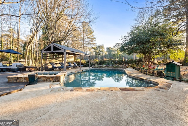 view of swimming pool featuring a gazebo, an in ground hot tub, and a patio