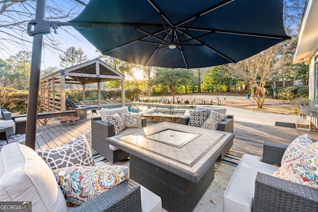 view of patio / terrace featuring an outdoor living space, a gazebo, and a swimming pool side deck