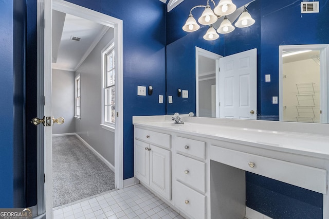 bathroom featuring vanity, crown molding, tile patterned floors, and an inviting chandelier