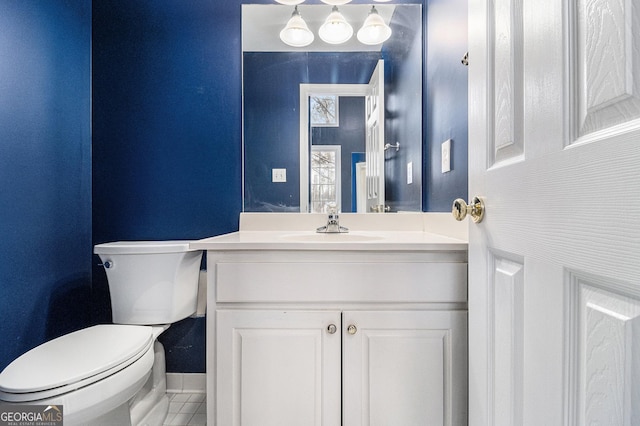 bathroom with vanity and toilet