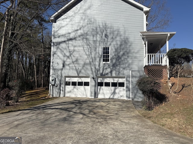 view of side of property featuring a garage