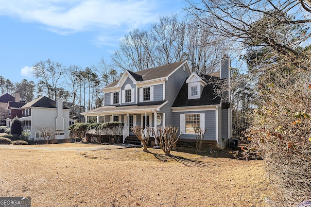 view of property with a porch and cooling unit