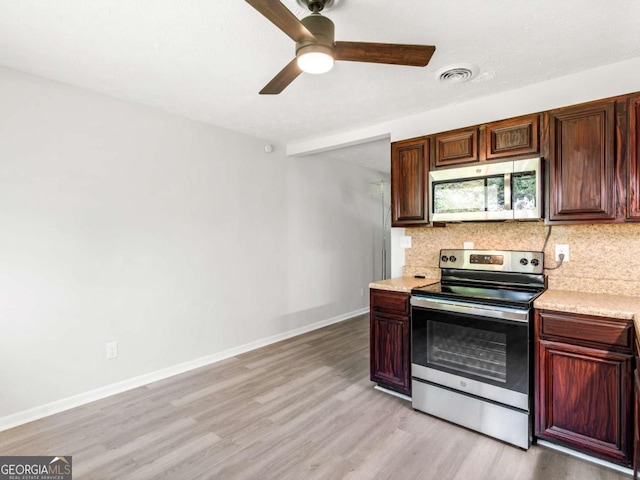 kitchen with tasteful backsplash, ceiling fan, stainless steel appliances, and light hardwood / wood-style floors