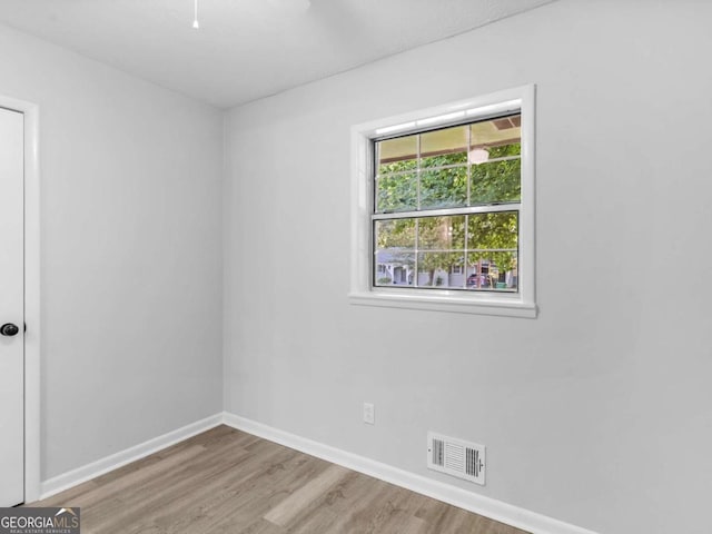 spare room with light hardwood / wood-style floors