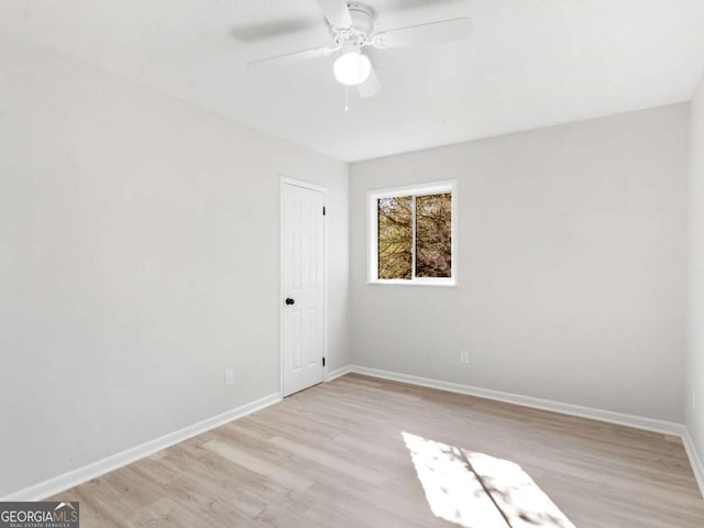 unfurnished room with ceiling fan and light hardwood / wood-style floors