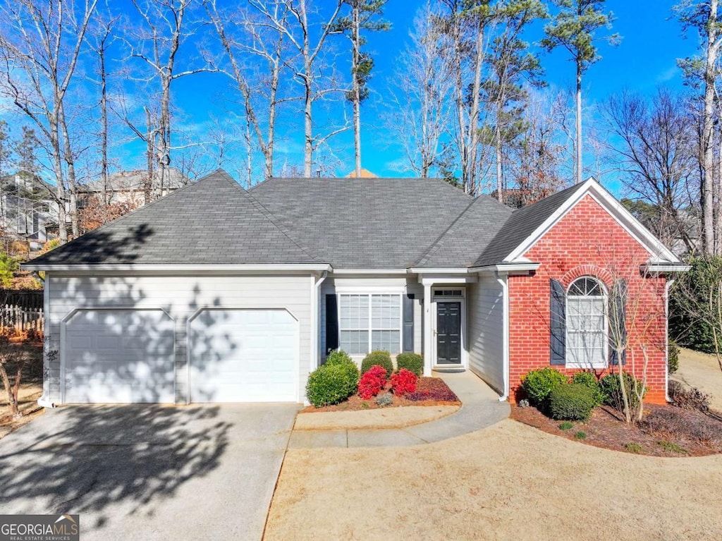 single story home featuring a garage