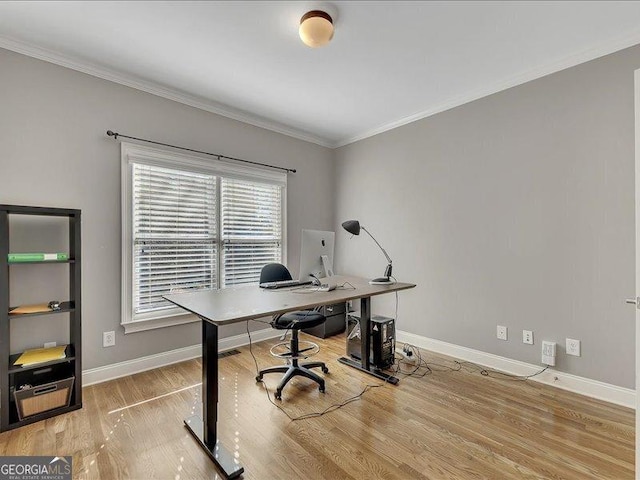 home office featuring hardwood / wood-style flooring and ornamental molding