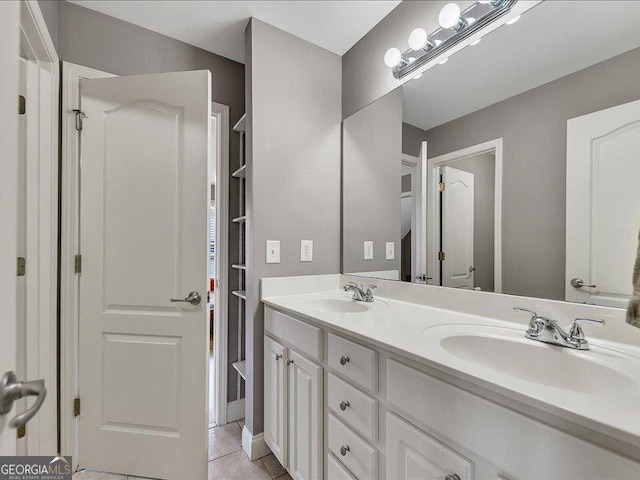 bathroom featuring tile patterned floors and vanity