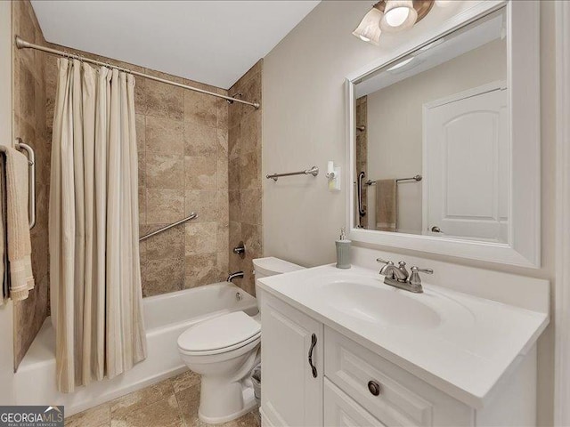 full bathroom with shower / bath combination with curtain, vanity, and toilet