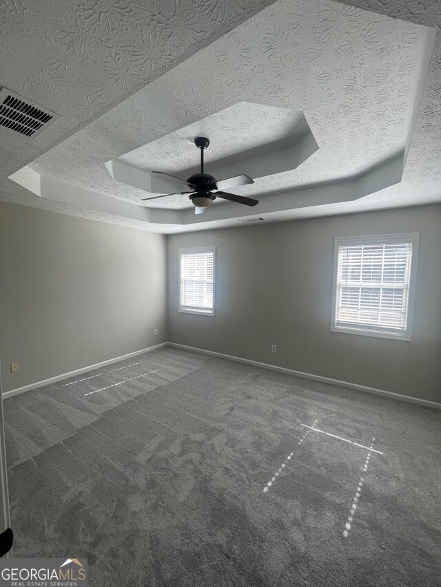 spacious closet featuring dark colored carpet