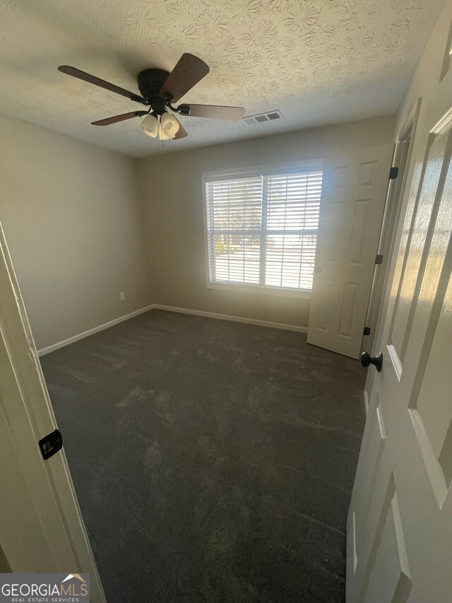 full bathroom featuring shower / bathtub combination, vanity, toilet, and a textured ceiling