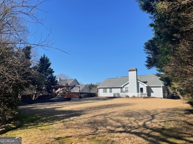 back of property featuring a lawn