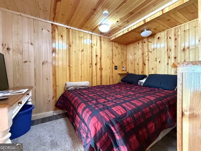 bedroom with wooden ceiling and wood walls