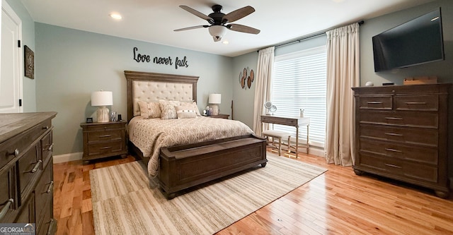 bedroom with ceiling fan and light wood-type flooring