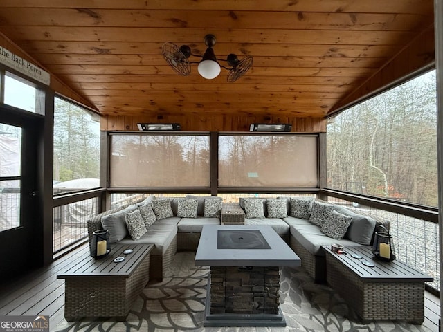 sunroom featuring vaulted ceiling and wooden ceiling