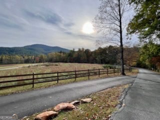 view of road featuring a mountain view and a rural view