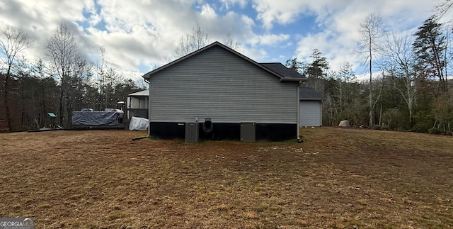 view of property exterior featuring a lawn