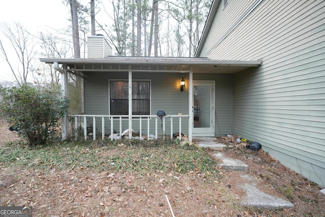 property entrance featuring covered porch