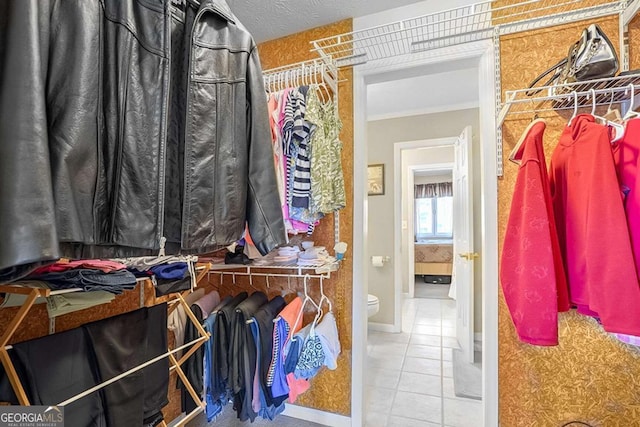 spacious closet featuring tile patterned flooring