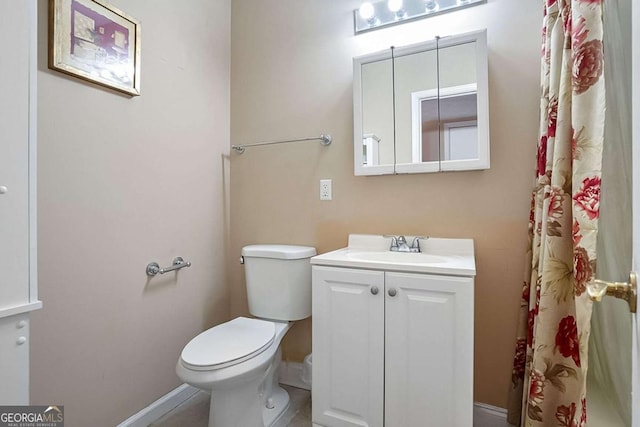 bathroom featuring vanity and toilet