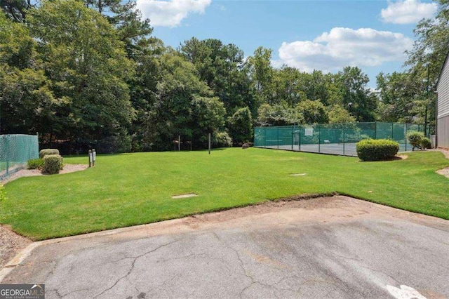 view of community featuring a yard and a patio