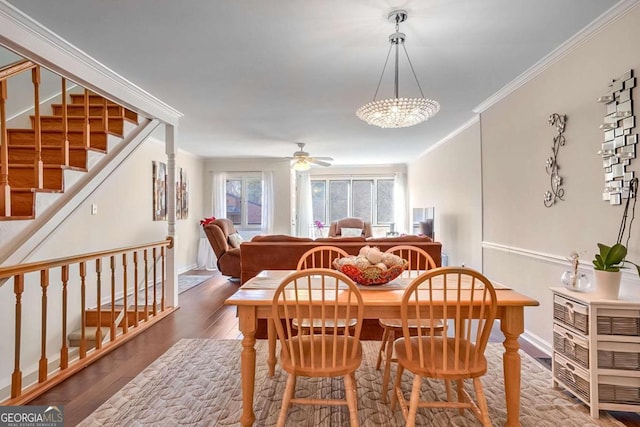 dining area with crown molding, hardwood / wood-style floors, and ceiling fan