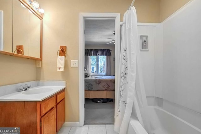 bathroom featuring vanity, shower / bathtub combination with curtain, and tile patterned floors