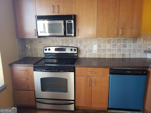 kitchen with appliances with stainless steel finishes and backsplash