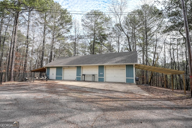 garage featuring a carport