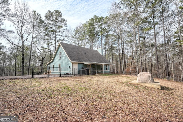 rear view of house with central air condition unit