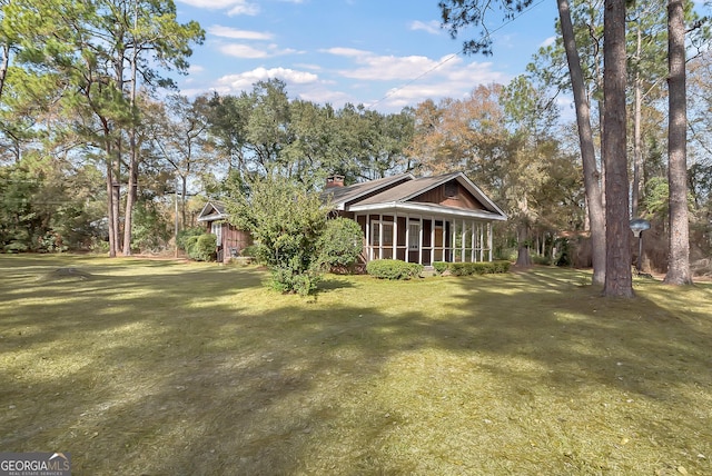 view of yard featuring a sunroom