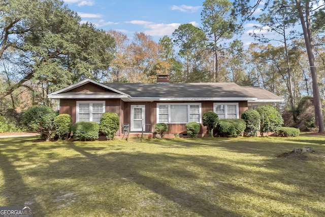 ranch-style home with a front yard