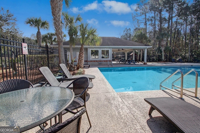 view of swimming pool with a patio area