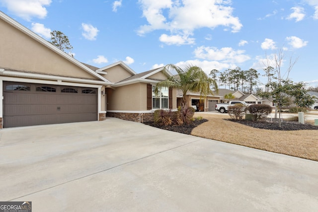 ranch-style house featuring a garage