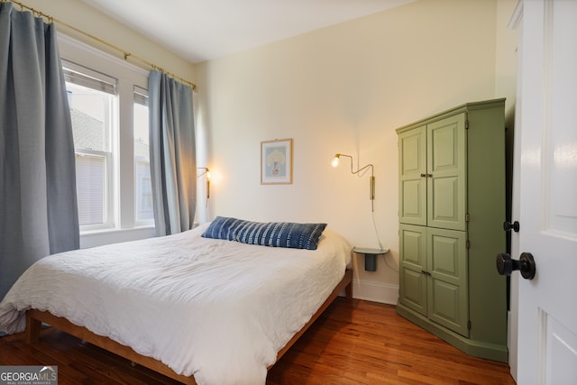 bedroom featuring hardwood / wood-style flooring