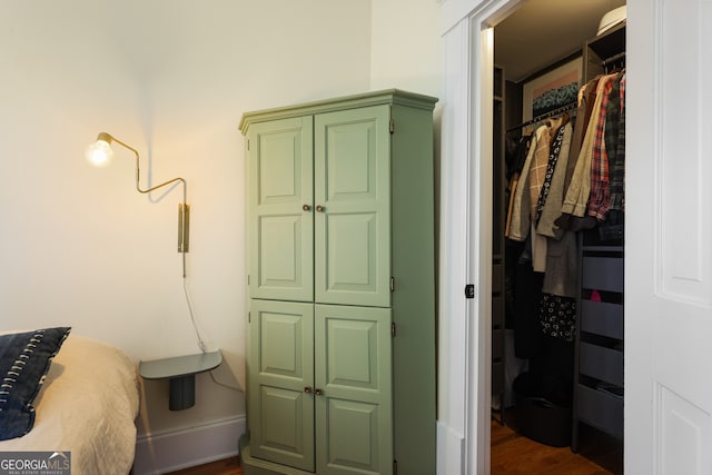 bedroom featuring dark hardwood / wood-style flooring