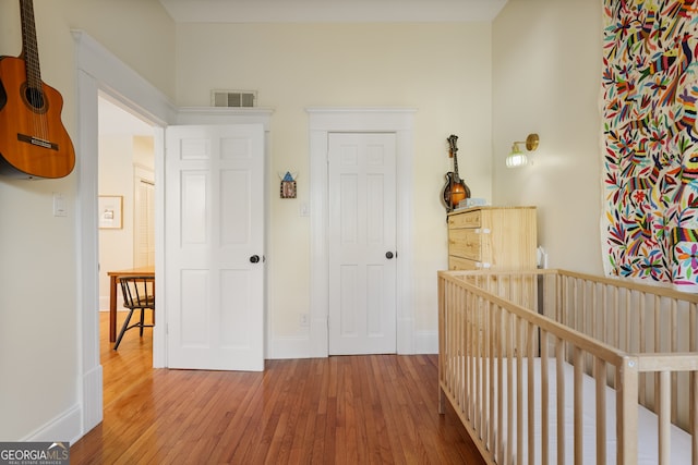 hallway with wood-type flooring