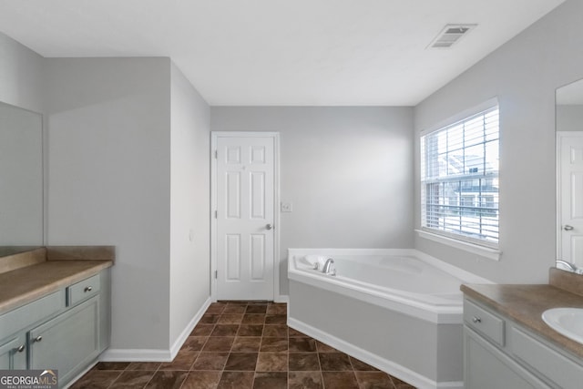 bathroom with vanity and a bathtub